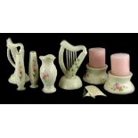 A collection of Donegal Belleek porcelain, various pieces decorated with pink flowers, to include