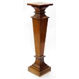 An Edwardian mahogany and boxwood strung square section urn stand, with checker banded border, on