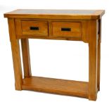 An oak serving or side table, the rectangular top with a granite insert above two frieze drawers,