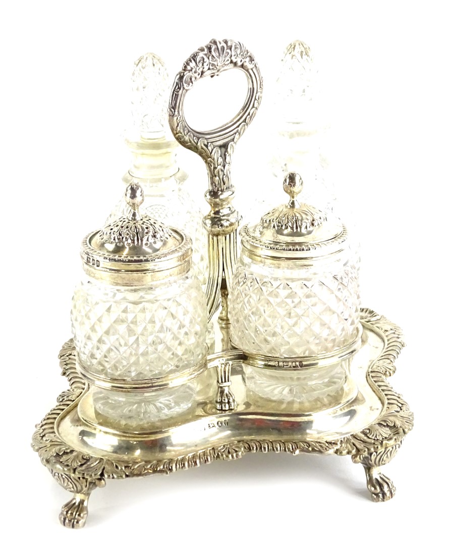 A William IV silver four bottle cruet, with cut glass, comprising two bottles and stoppers, (AF),