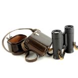 A pair of Carl Zeiss Dialyt 8x30 B binoculars, in a brown leather case, the binoculars 11.5cm high.