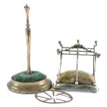 An Edwardian silver hat pin holder, modelled in the form of an umbrella stand, on a weighted moulded