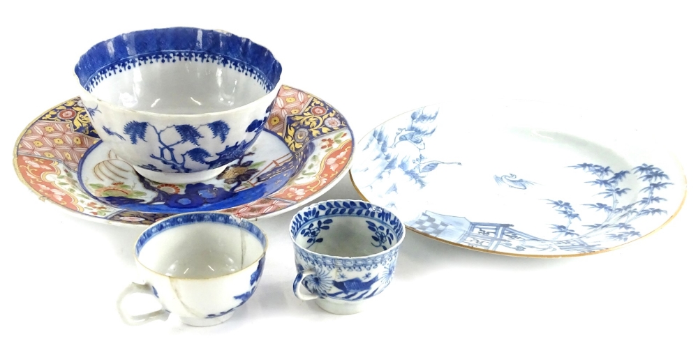 A Chinese export blue and white plate, decorated with geese, bamboo and a terrace, in blue within