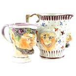 A 19thC Staffordshire jug, decorated with three grotesque masks surrounded by brown, iron red and