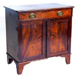 An early 20thC mahogany side cabinet, the top with rounded corners above a frieze drawer, and two