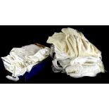 A quantity of textiles, to include christening robes, lace, etc.