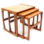 A G-plan teak nest of three tables, on end supports, 53cm wide.