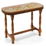 A Victorian walnut bead work stand, decorated with flowers, on later turned legs with H stretcher,