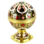 A Royal Crown Derby porcelain Millennium globe clock, with gilt motto to interior There is a