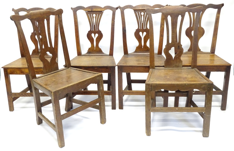 A harlequin set of six 19thC oak dining chairs, each with a pierced vase shaped splat and a solid
