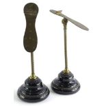 A pair of Victorian Harris and Sheldon Birmingham shoe stands, each on a leaf moulded column and