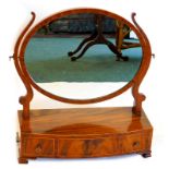 A 19thC mahogany and boxwood strung dressing table mirror, the oval mirror plate on shaped supports,