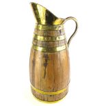 An oak and brass coopered large flagon or stick stand, 68cm high.
