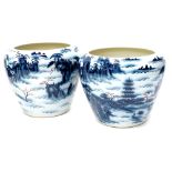 A pair of late Chinese porcelain jardiniere's, each decorated with buildings, clouds, etc., and with