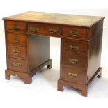 A late 19thC mahogany pedestal desk, the top with a brown leather inset and a moulded edge, above an