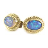 A pair of 9ct gold opal earrings, each set with oval opal in rub over setting, with rope twist