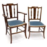 An Edwardian mahogany and marquetry open armchair, with a blue padded seat on shaped legs, and a