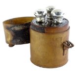 A George V silver three piece glass and silver mounted hunting flask set, in a leather container,