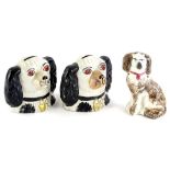 A pair of 19thC Staffordshire pottery Spaniel money boxes, 10cm high, and a Staffordshire pottery