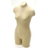 A female mannequin, lacking stand, 78cm high.