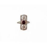 A Victorian ruby and diamond panel ring, the panel set with two old cut diamonds, each 4.2mm x 4.2mm