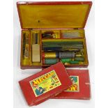 A Meccano No. 7 box containing various items of Meccano, two Meccano accessory outfit numbers 4a and