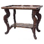 An oriental lotus carved side table, with a raised gallery on shaped legs with under tier, 69cm