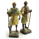 A pair of continental cold spelter figures , each modelled in the form of Arab or Moorish