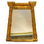 A Victorian gilt gesso overmantel, with an inverted break front cornice above rectangular plate,