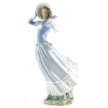 A Lladro porcelain figure, Spring Breeze, model 4936, issued 1974-1991, (finger AF), 36cm high.