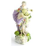 A late 18thC Derby porcelain figure, modelled in the form of a lady holding wheat, on a gilt
