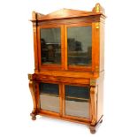 A Regency rosewood and brass cabinet, the top with an arched cornice flanked by lotus and acanthus