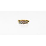 An 18ct gold diamond three stone ring, with three round brilliant cut diamonds, approx 5.2mm x 5.2mm