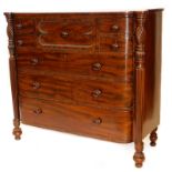 An early Victorian figured mahogany bow fronted chest of drawers, of bow fronted form with a central