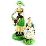 Two 19thC English porcelain figures, a Derby seated lady with a dog, 13cm high, and another figure