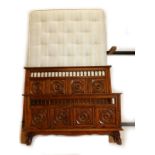 A Seventh Heaven Victorian style carved oak double bed head and foot, with mattress.