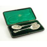 A pair of early 20th silver ornamental spoons, each with pierced and twisted handle and an