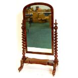 A Victorian figured mahogany cheval mirror, with an arched plate, spirally turned supports and