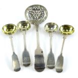 Four fiddle pattern silver mustard spoons, each with an engraved handle and a fiddle pattern
