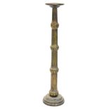 A continental gilt candle stand, with metal pricked attachment to the dish top, on a domed foot,