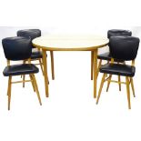 A set of four 1950s/60s dining chairs, each with a black leatherette padded back, on beech turned