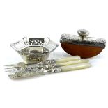 A collection of small silver and silver mounted items, to include two butter knives, a small fork, a