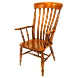 A 19thC lathe back beech and elm open armchair, on turned tapering legs with H stretcher, stamped to