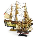 A wooden model of a three masted frigate on wooden base, 45cm wide and a small model of the Cutty