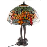 A Tiffany style lamp base, a shade decorated with coloured glass cabochon, dragonflies etc., on a