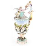 A continental porcelain ewer, elaborately decorated with putti, sturgeon etc., blue cross swords