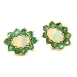 A pair of 9ct gold emerald and opal stud earrings, each cluster with central opal surrounded by