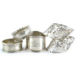 A collection of five early 20thC napkin rings, to include a pair with pierced borders, (AF), 3¼oz.