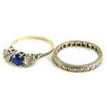 Two dress rings, to include a 9ct gold and silver three stone dress ring, and a silver eternity