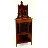 A late 19th/early 20thC walnut standing corner cabinet, top with two bevelled mirror plates, above a